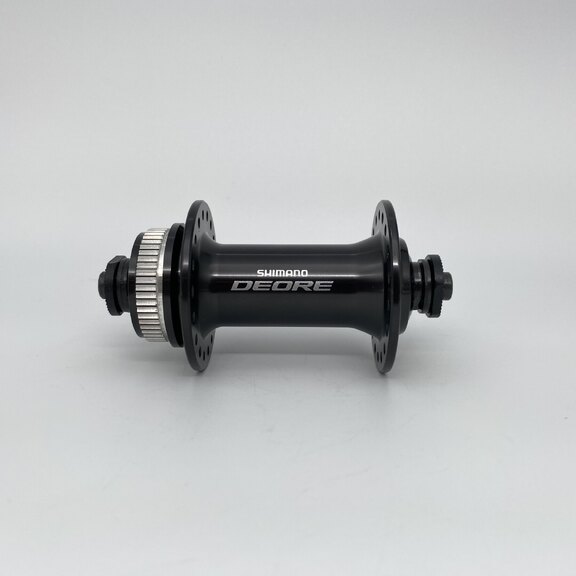 Voornaaf / 100 MM / Uitvalas / Disc (Centerlock) / 36GTS / Shimano / FH-M6000 Deore / Zwart / MTB - Tour 
